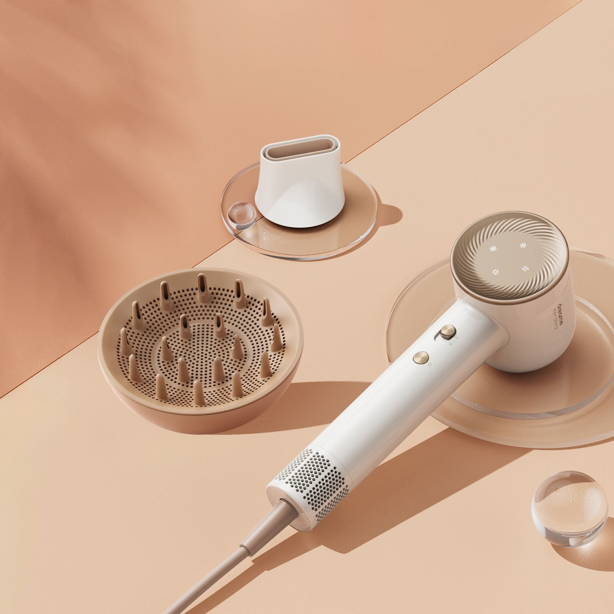 Dreame high-speed hair dryer with diffuser and styling nozzle attachments on peach-toned background