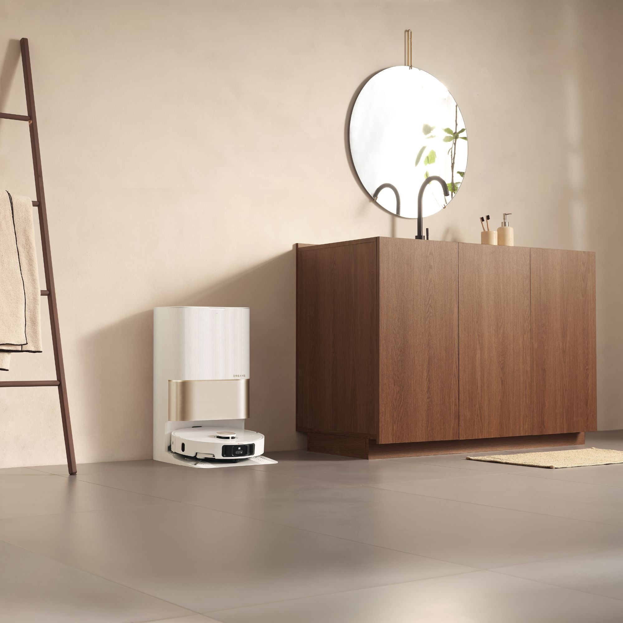 Dreame robot vacuum docked at its self-cleaning station in a minimalist bathroom setting.