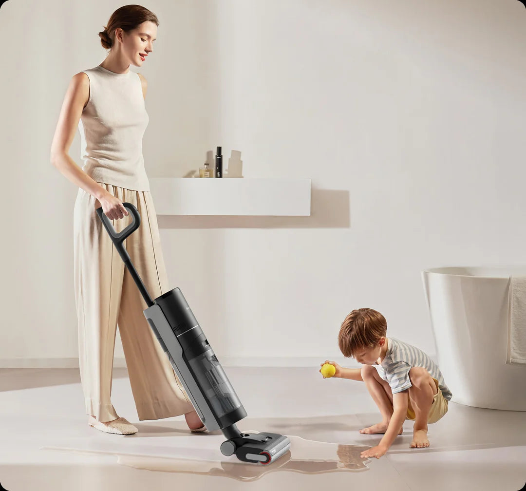 Dreame wet and dry vacuum cleaning bathroom floor as child spills water